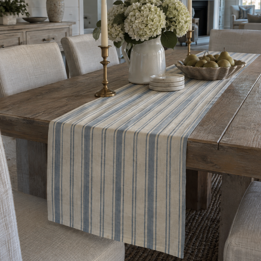 Blue-gray and ivory striped coastal table runner with tailored vertical stripes for a beach house dining table