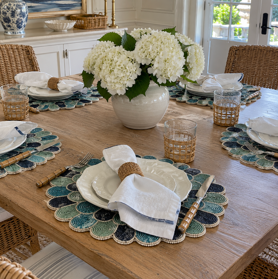 Blue and green beaded placemats for elegant coastal table decor