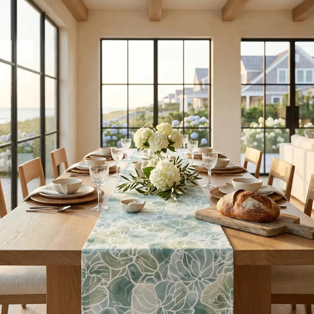 Blue green coastal flora table runner creating an ocean-inspired tablescape with glassware