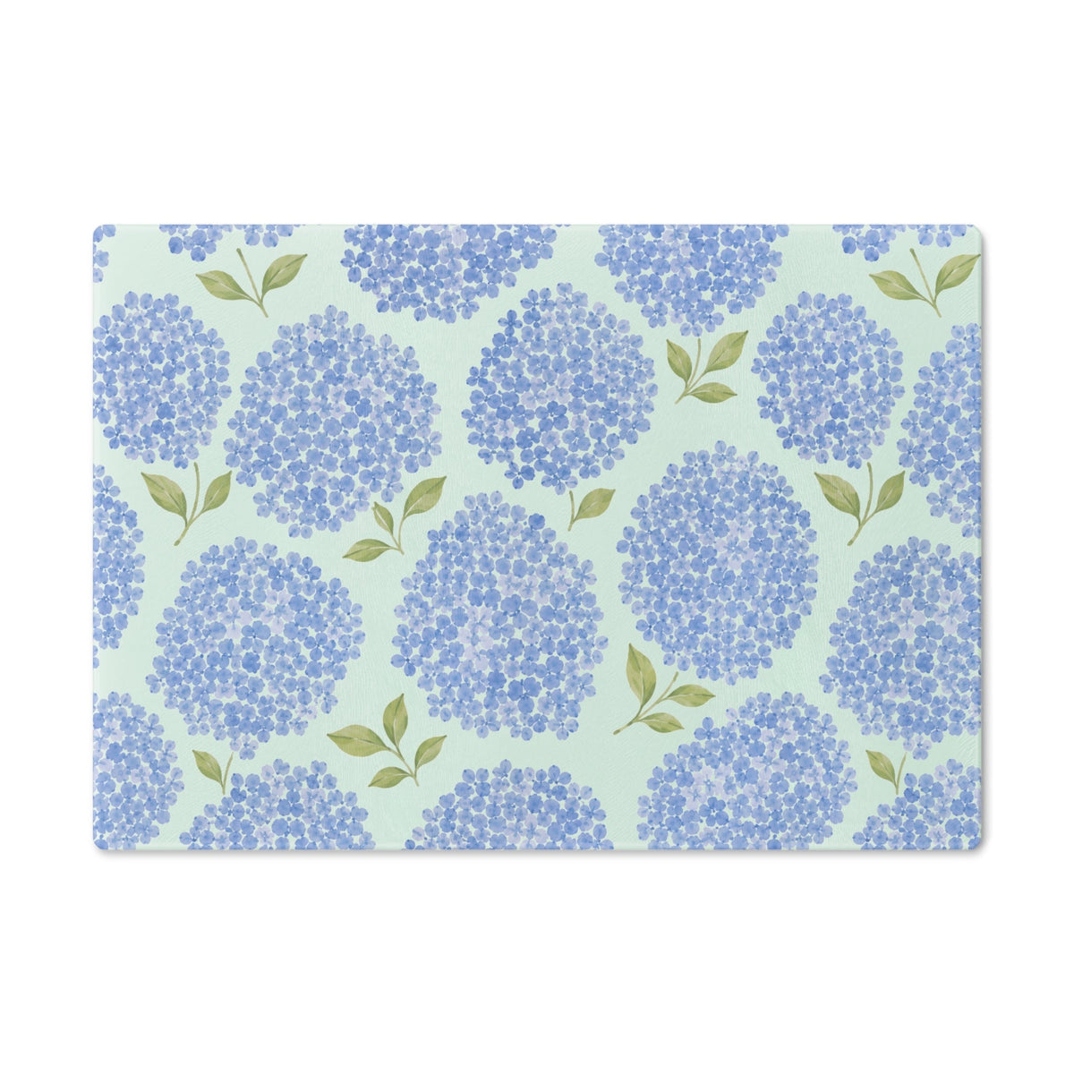 Blue hydrangea floral cutting board with soft green leaves for a coastal cottage kitchen