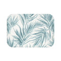 Blue palm bath mat for a light, airy bathroom.