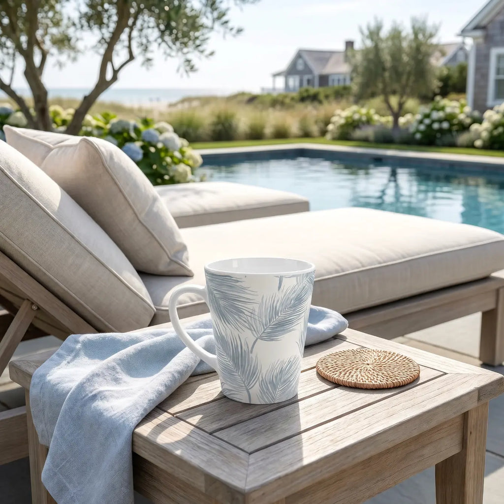 Blue palm trees coffee mug sitting on a coastal-style countertop
