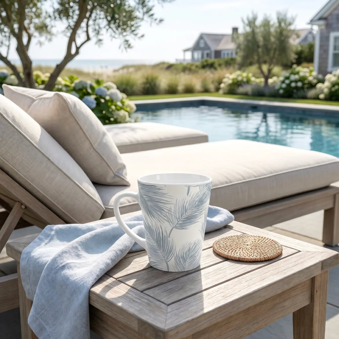 Blue palm trees coffee mug sitting on a coastal-style countertop
