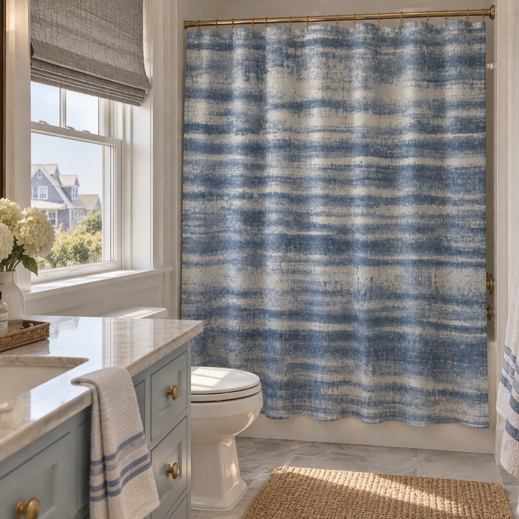 Blue washed stripe shower curtain for a relaxed coastal bathroom