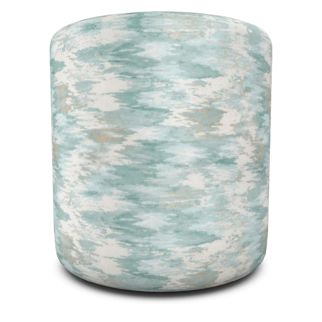 Coastal blue cylinder pouf providing extra seating, a footrest, or a flexible accent piece.