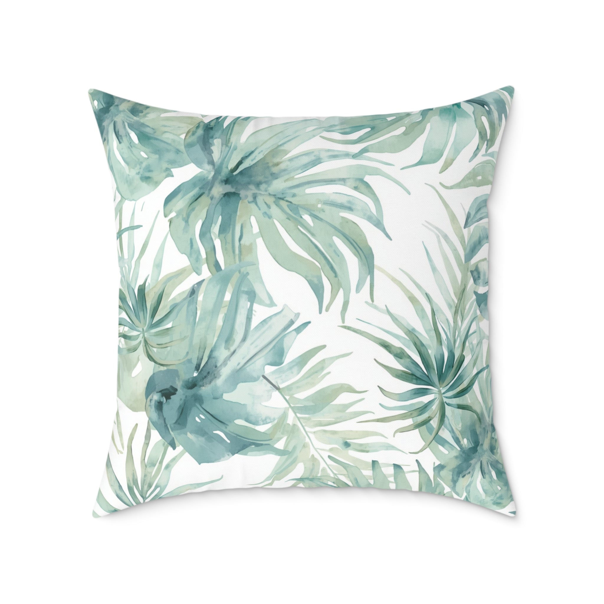 Soft blue watercolor palm print pillow for coastal chic couch or accent chair decor.