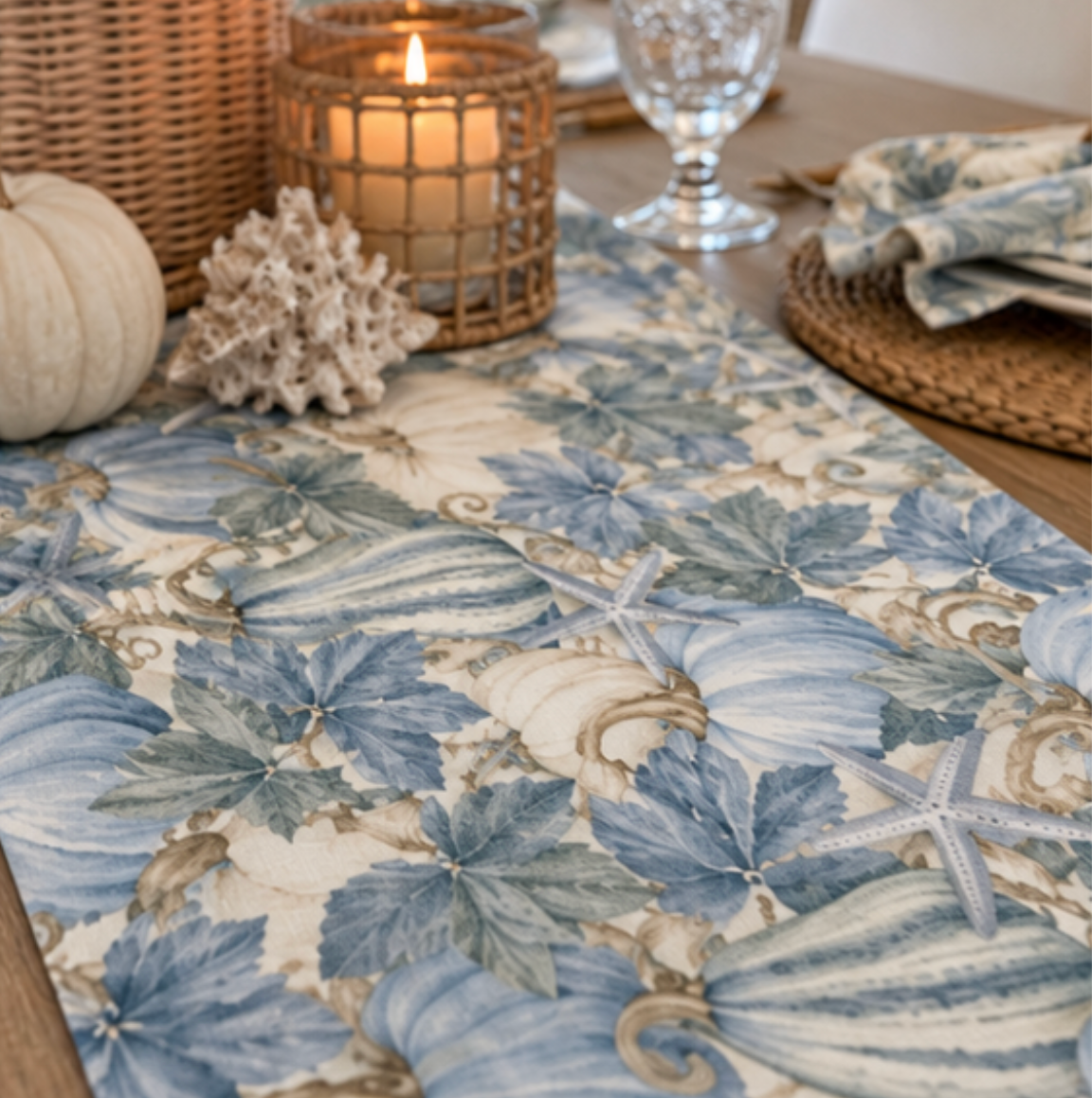 Blue and white table runner with a coastal seashell design styled in a beach house dining room.
