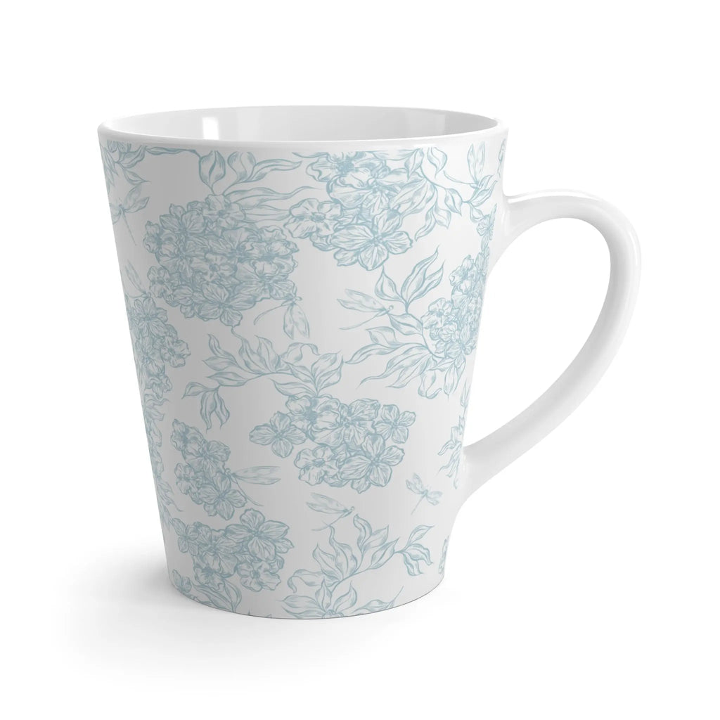 White mug with light blue floral pattern on a white background