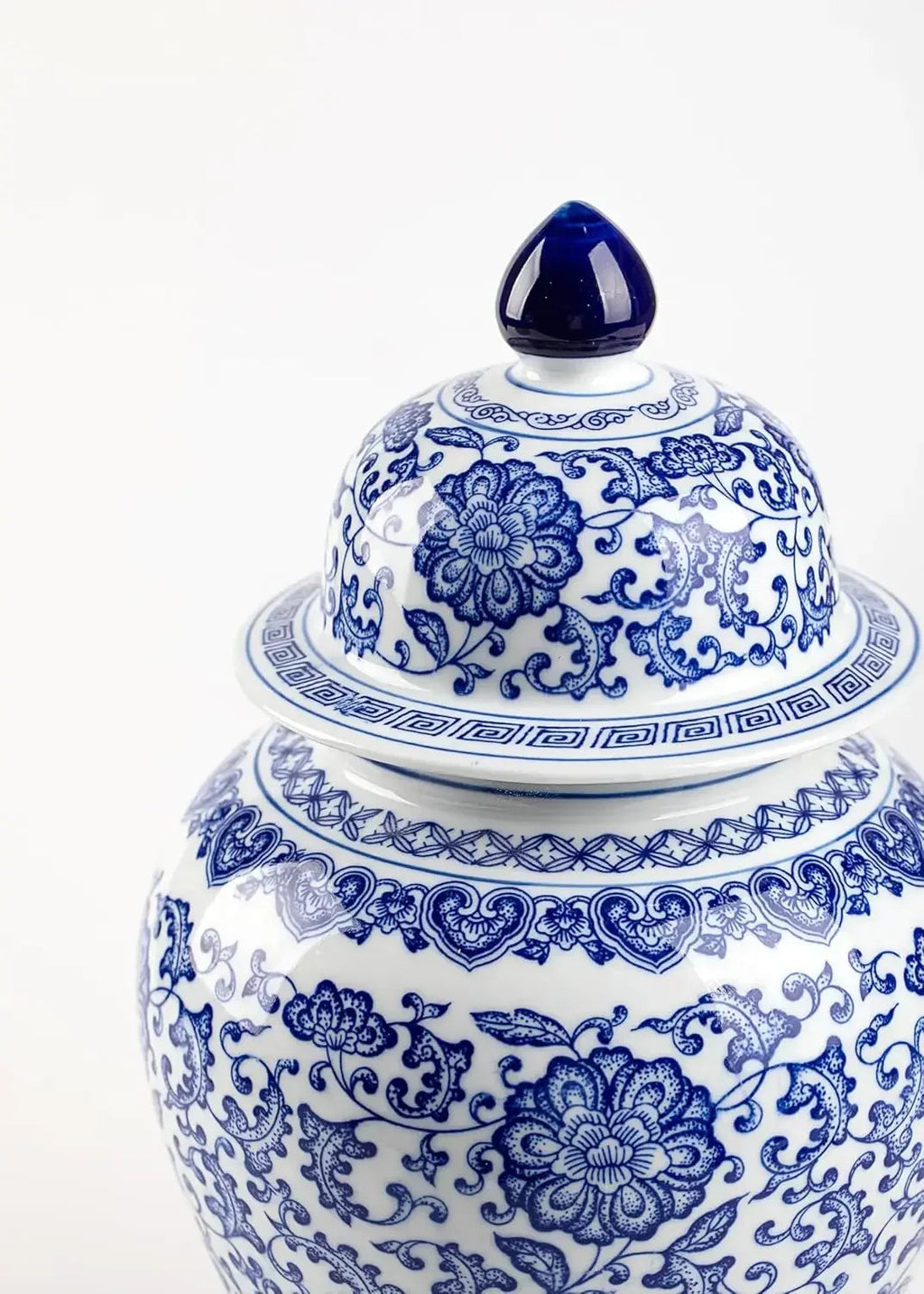 Blue and white ceramic ginger jar with detailed floral scrollwork for elegant coastal home decor