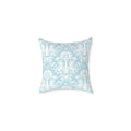 vintage damask accent pillow layered with textured throws