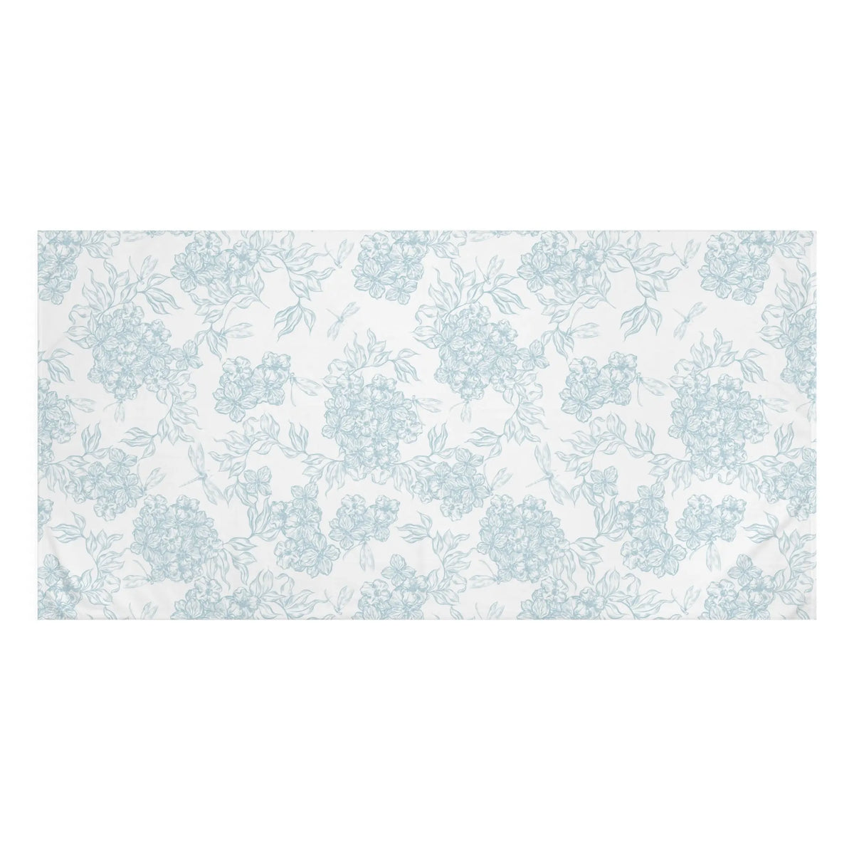 Blue and white floral bath towel styled in a coastal home bathroom