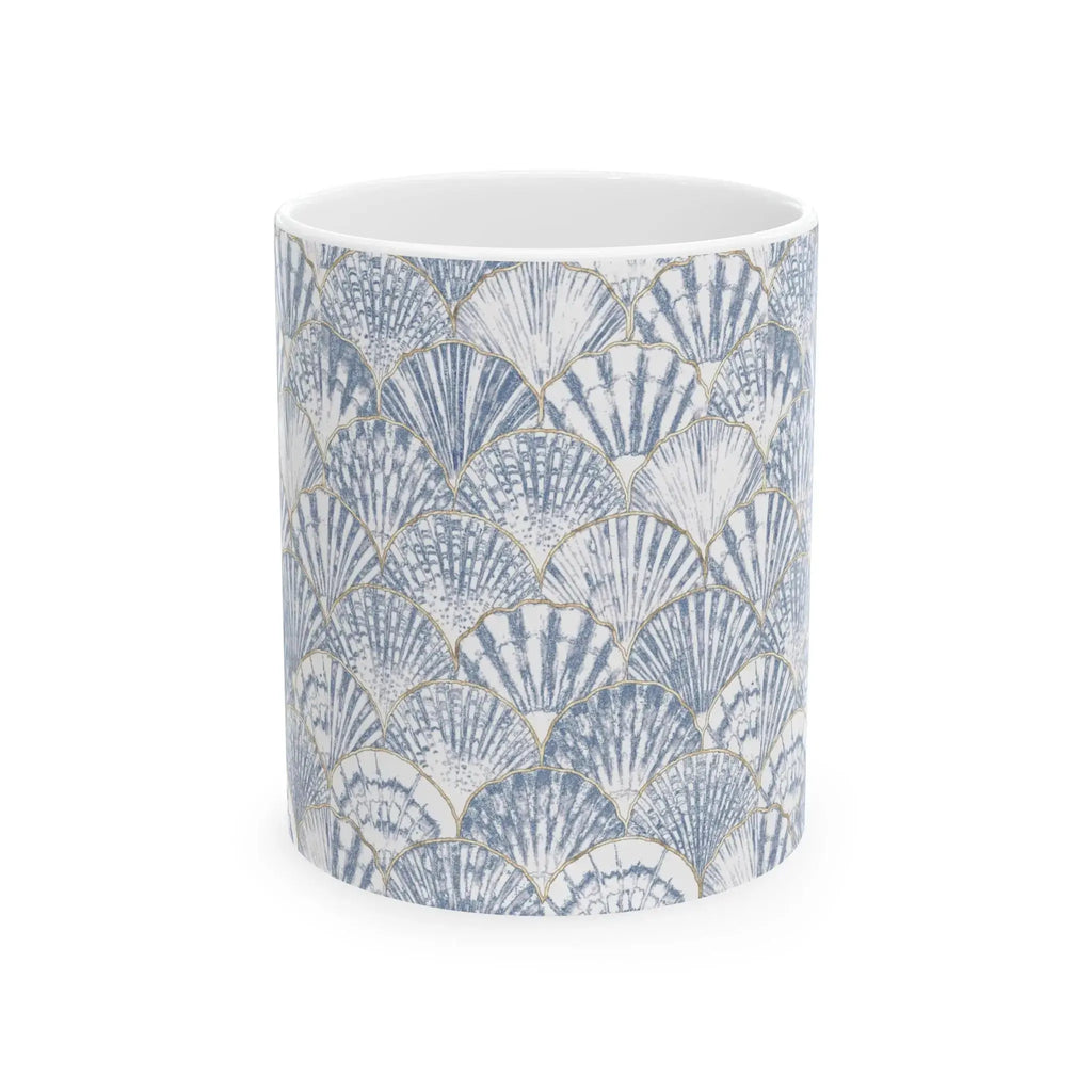 Blue and white seashell coffee mug on a beach house counter