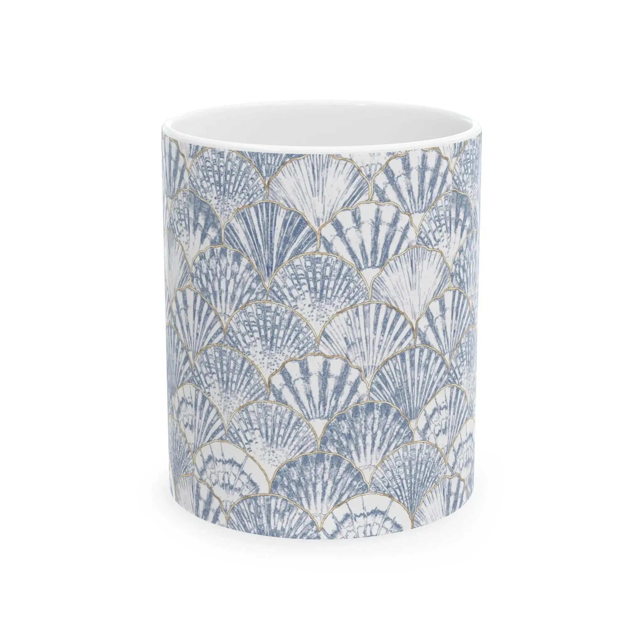 Blue and white seashell coffee mug on a beach house counter