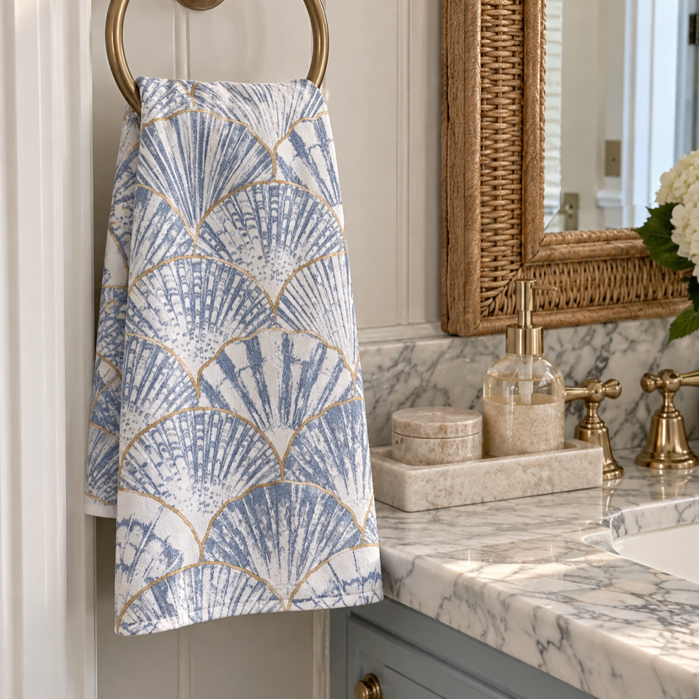 Blue and white seashell hand towel for a coastal bathroom