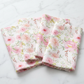 Pink floral print linen cloth napkins set of four styled for a garden party table setting