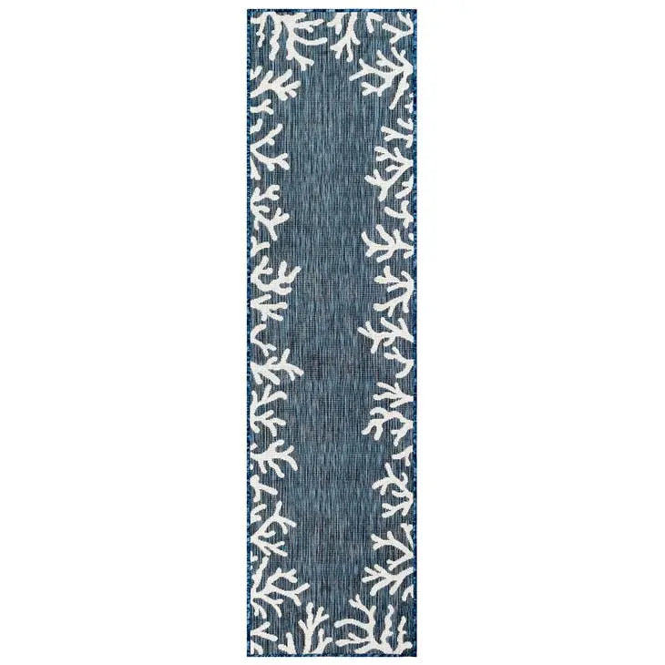 Navy blue runner rug with white coastal patterns on a white background