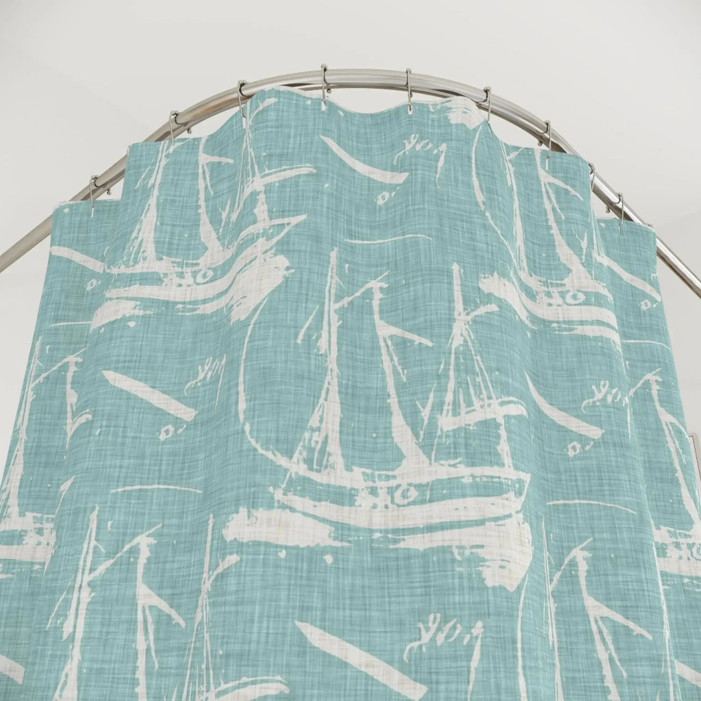 Beach house bathroom featuring a blue sailboat bath curtain