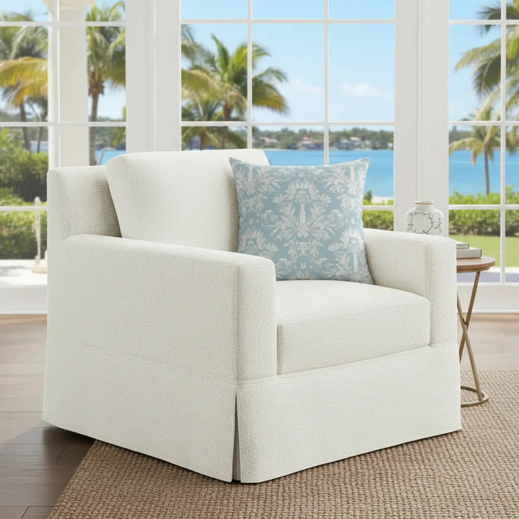 light blue damask throw pillow styled on a neutral fabric sofa