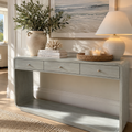 Three drawer coastal entryway console table with lower display shelf for hallway storage and decorative accents.