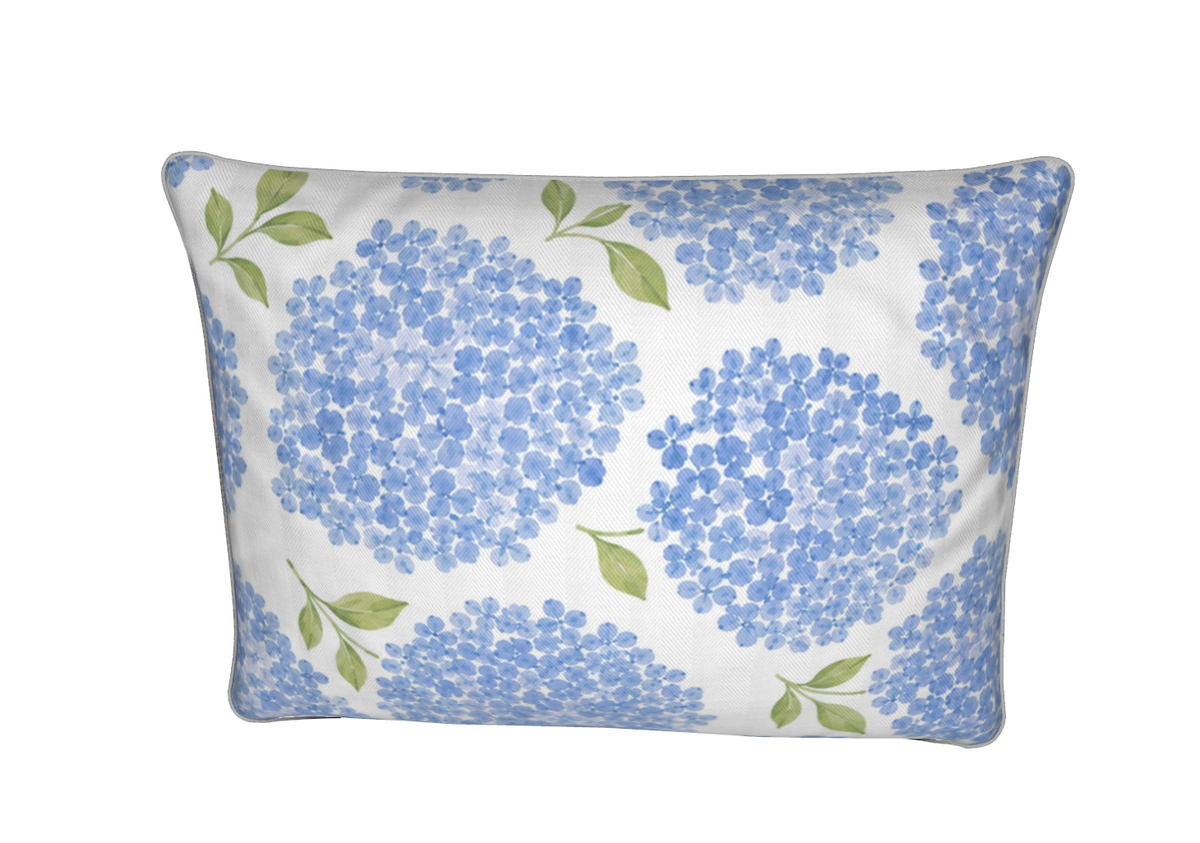 Coastal blue floral accent pillow with soft hydrangea blossoms for a beach house or cottage