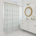 Coastal Breeze Shower Curtain in pale blues and sandy neutrals on 100% polyester, in a bright spa-style bathroom.