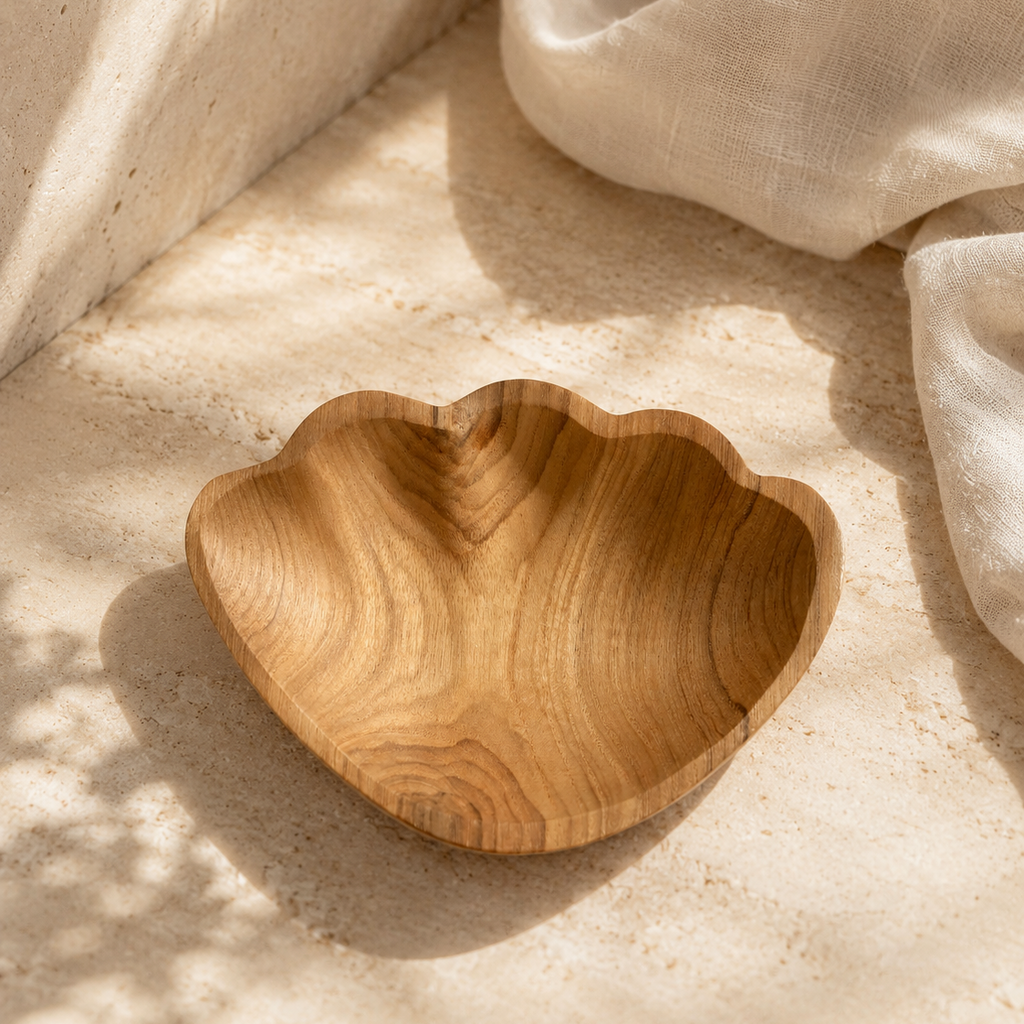 Beach house inspired teak shell tray with a refined natural aesthetic.