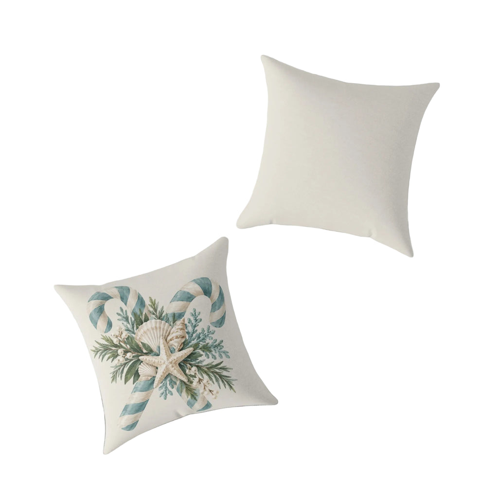 Close-up of the starfish, scallop shell, and pearl berry detail on a coastal candy cane holiday throw pillow