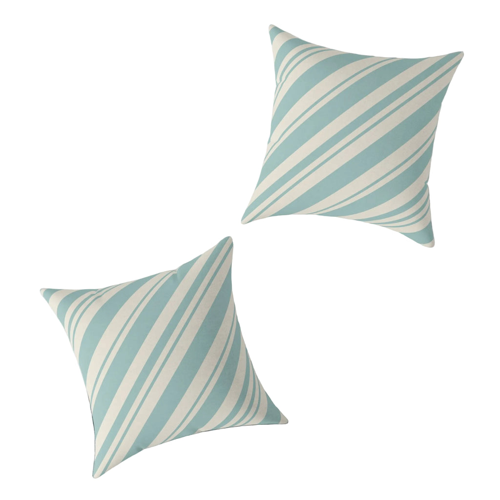 Blue peppermint striped pillow paired with a coastal candy cane and starfish pillow for a matching Christmas set