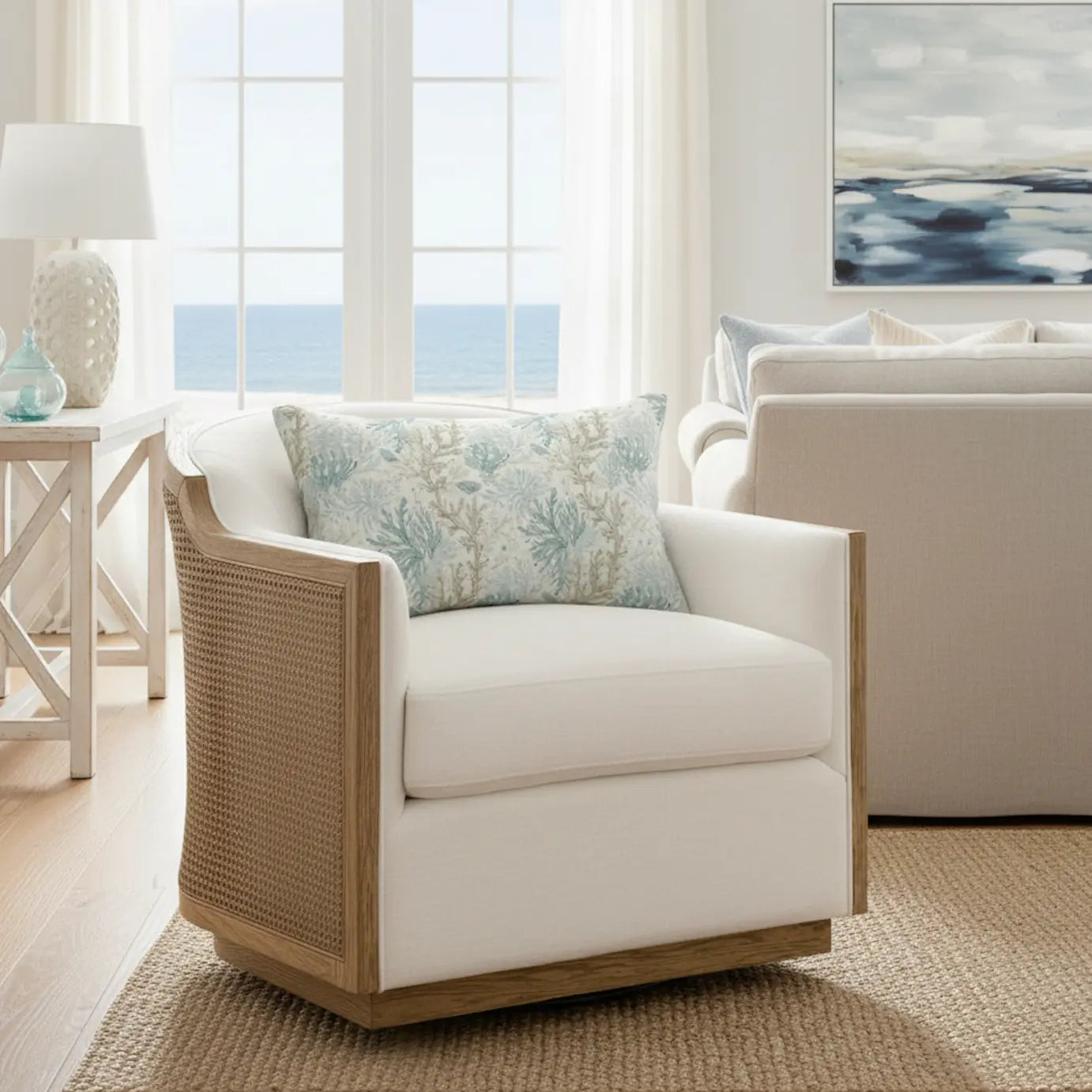 Coral Cove Lumbar Throw Pillow with aqua coral motif on light fabric, adding coastal elegance to a white armchair.