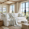 Coastal woven blanket featuring an allover coral branch pattern in muted aqua and sandy neutral tones.