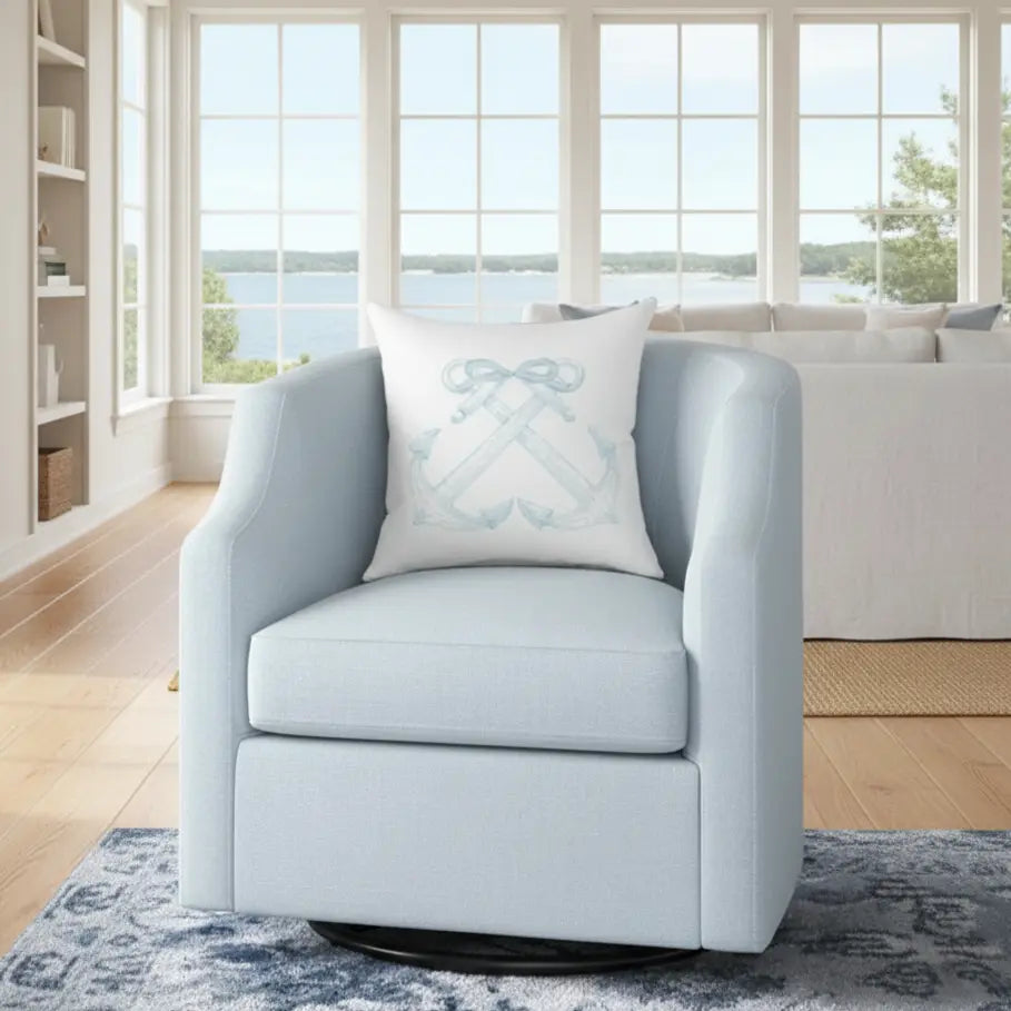 Anchorline Pillow with blue anchor and rope motif on a light blue armchair in a coastal living room