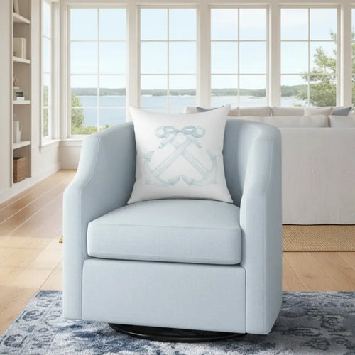 Anchorline Pillow with blue anchor and rope motif on a light blue armchair in a coastal living room