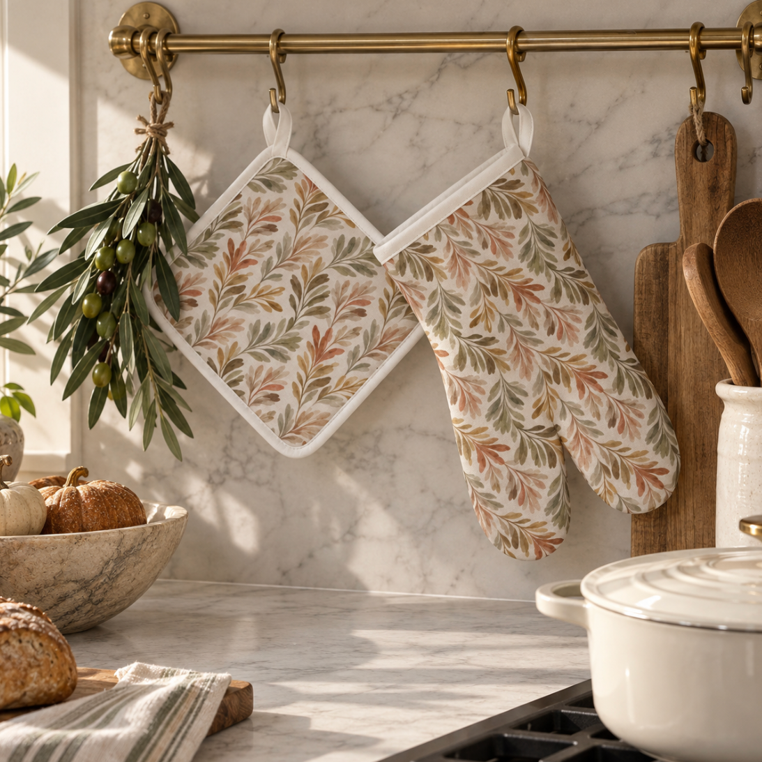 Autumn botanical oven mitt set with white piping, designed for fall kitchen decor and gift-giving"