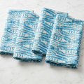 Fish print linen cloth napkins set of four styled for a beach house table setting