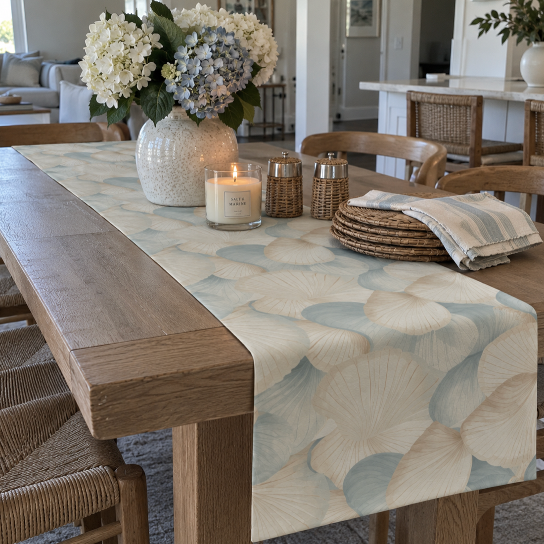 Coastal grandmillennial shell table runner with an elegant blue-and-ivory scallop pattern