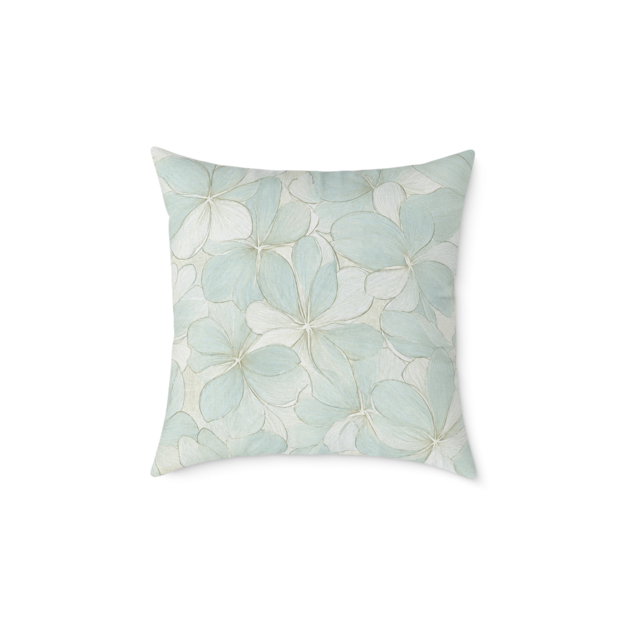 Soft blue hydrangea throw pillow on a neutral sofa for a bright coastal living room