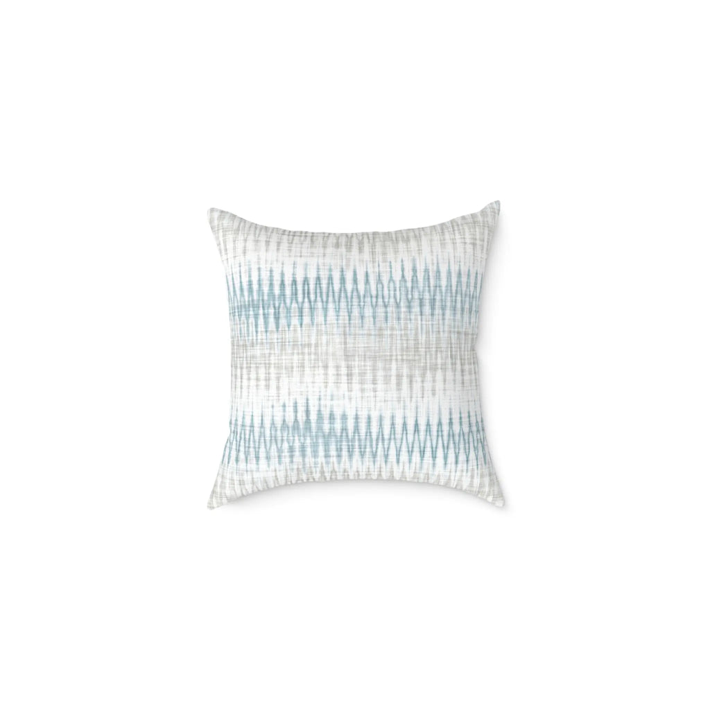 Stonewash Ikat throw pillow with blue and gray coastal ikat pattern on a light neutral background.