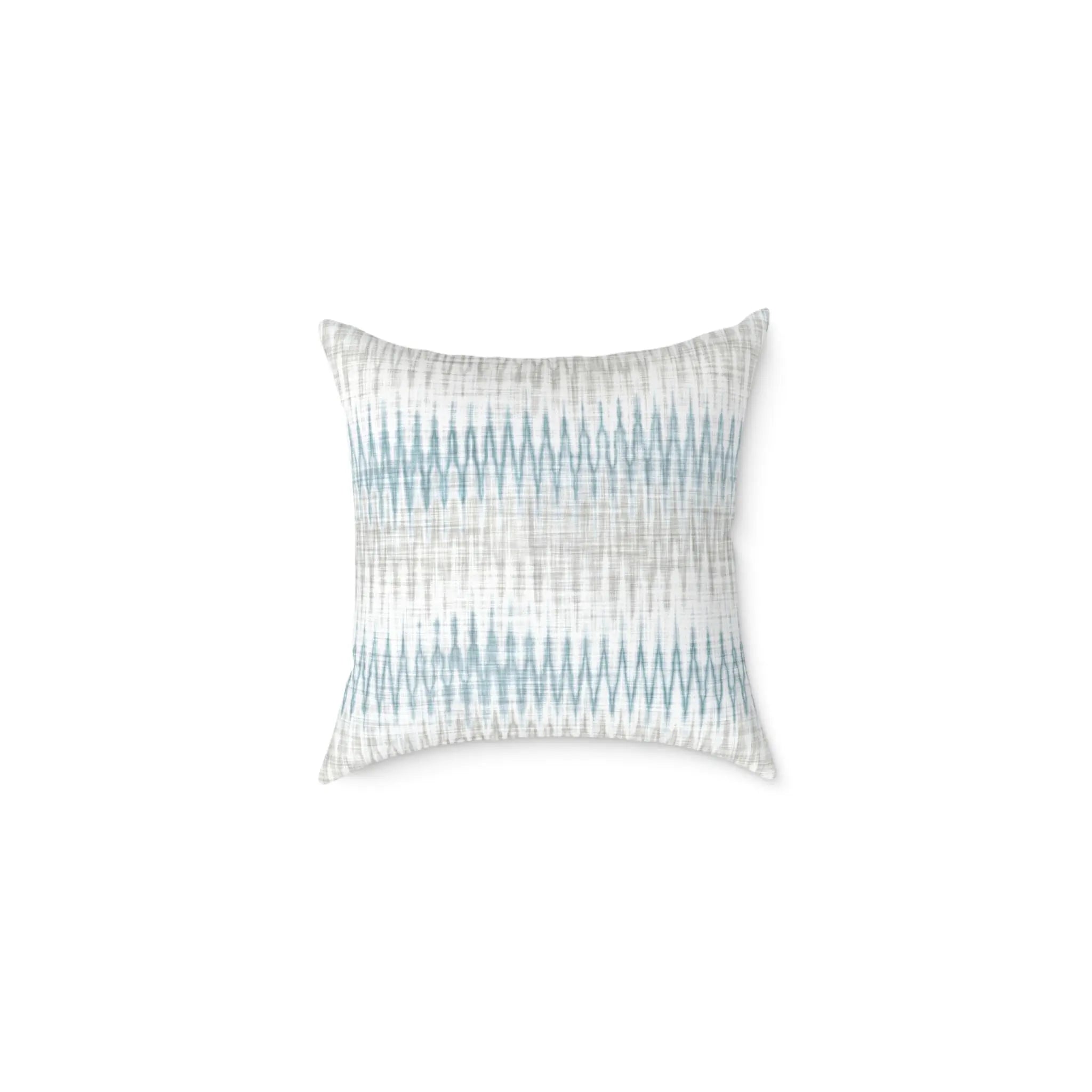 Stonewash Ikat throw pillow with blue and gray coastal ikat pattern on a light neutral background.