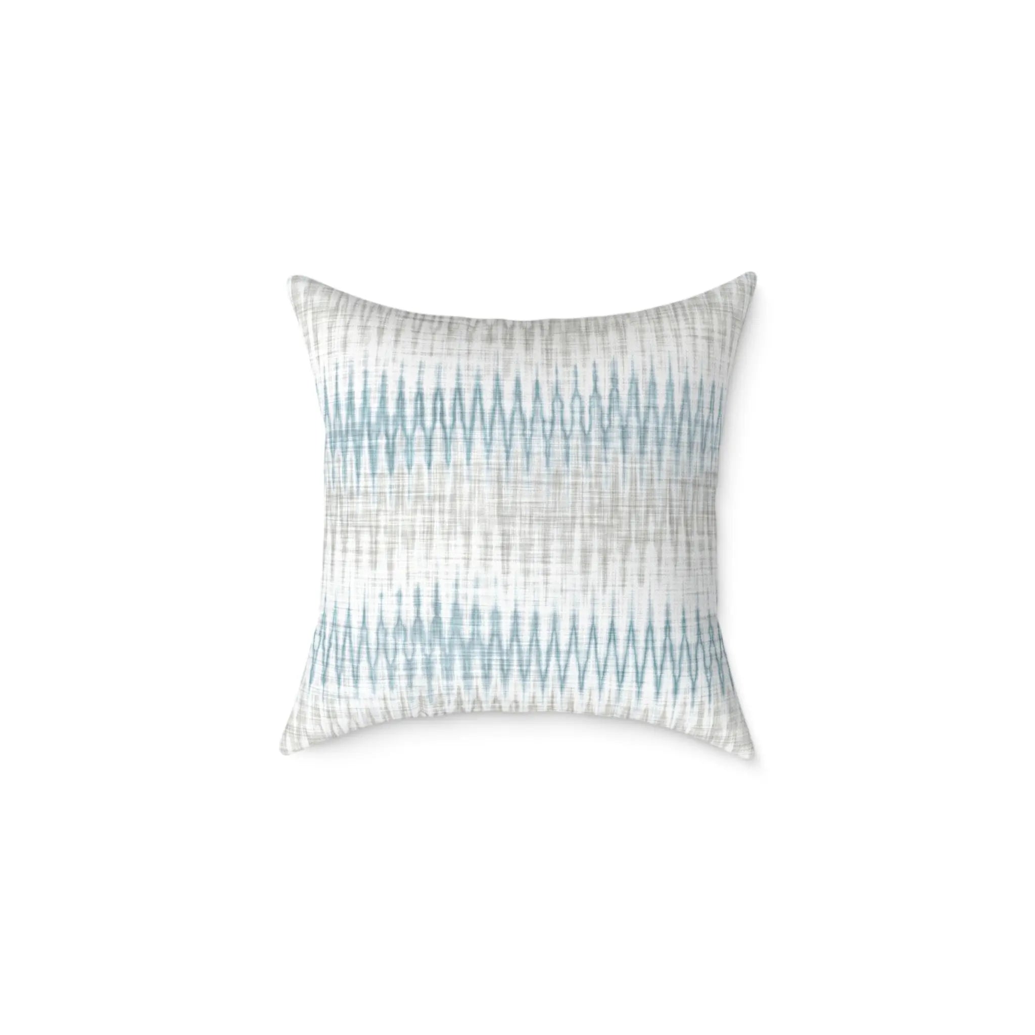 Stonewash Ikat Throw Pillow with blue and neutral coastal ikat pattern on light fabric.