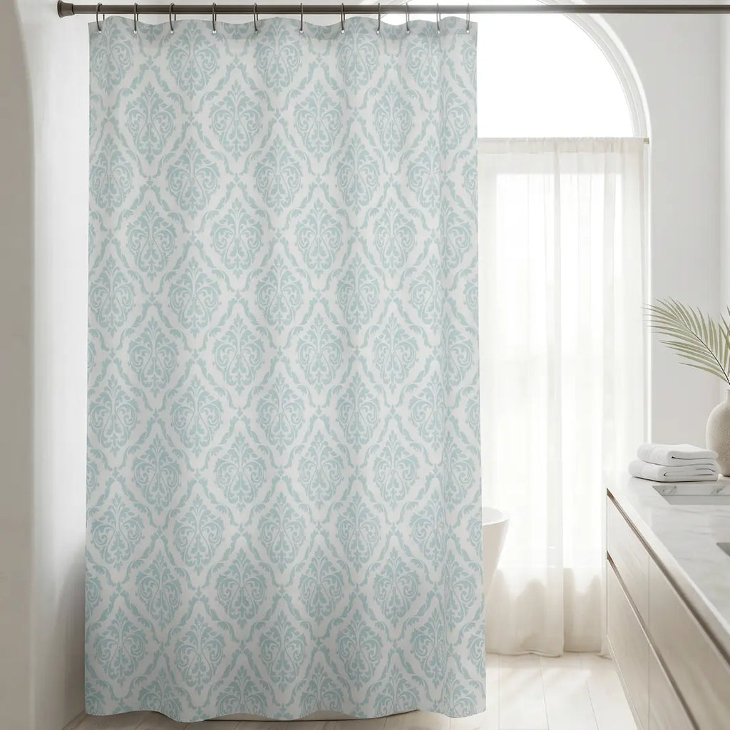 Coastal bathroom featuring a soft aqua damask patterned curtain