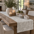 Coastal neutral floral table runner with muted taupe botanical artwork on an ivory background