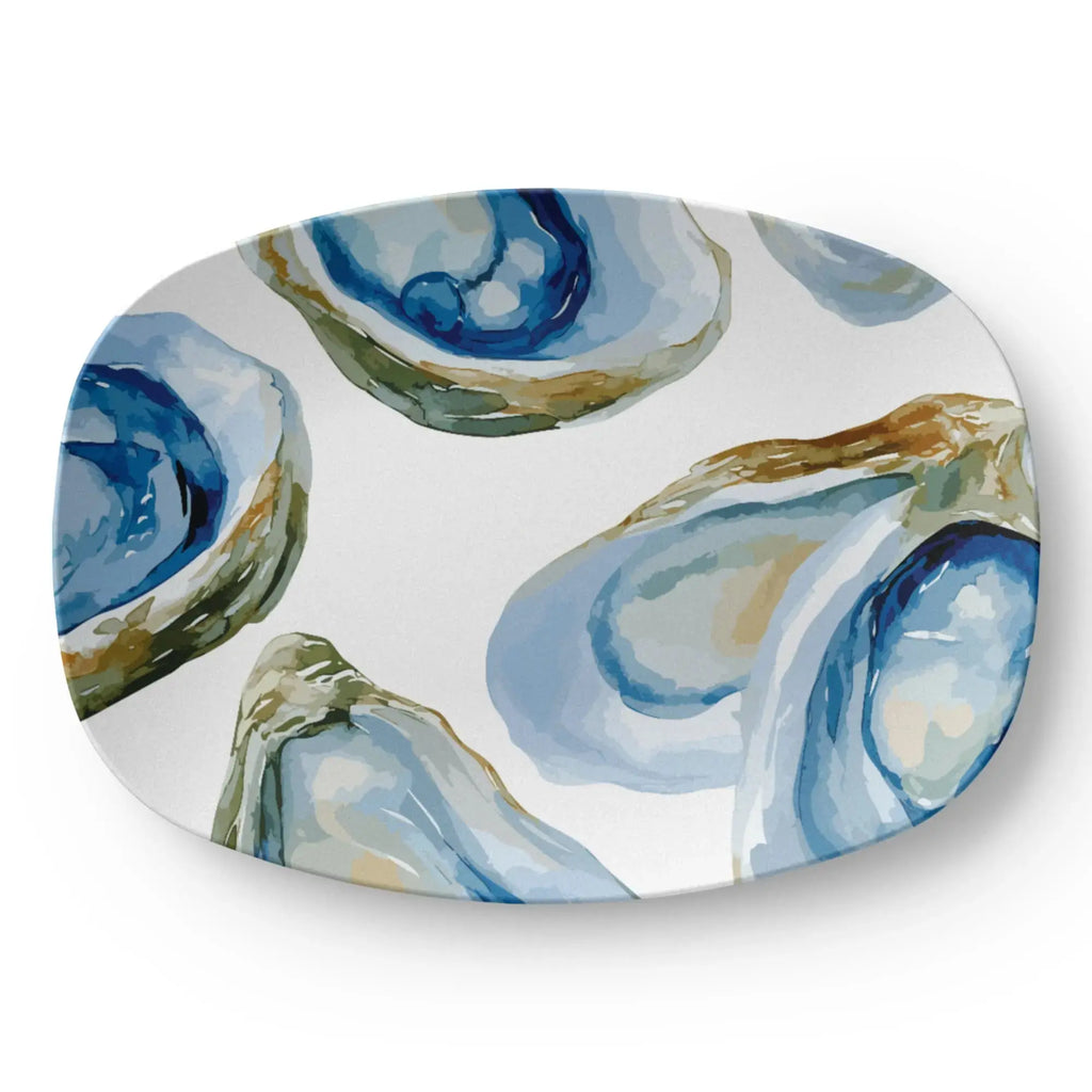 Coastal serving tray with a durable satin finish and oval shape.