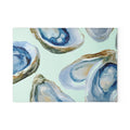Oyster Cutting Board with blue oyster shell motif on mint background