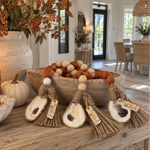 Coastal oyster shell tassel garland with rust, cream, and brown felted balls for fall home decor