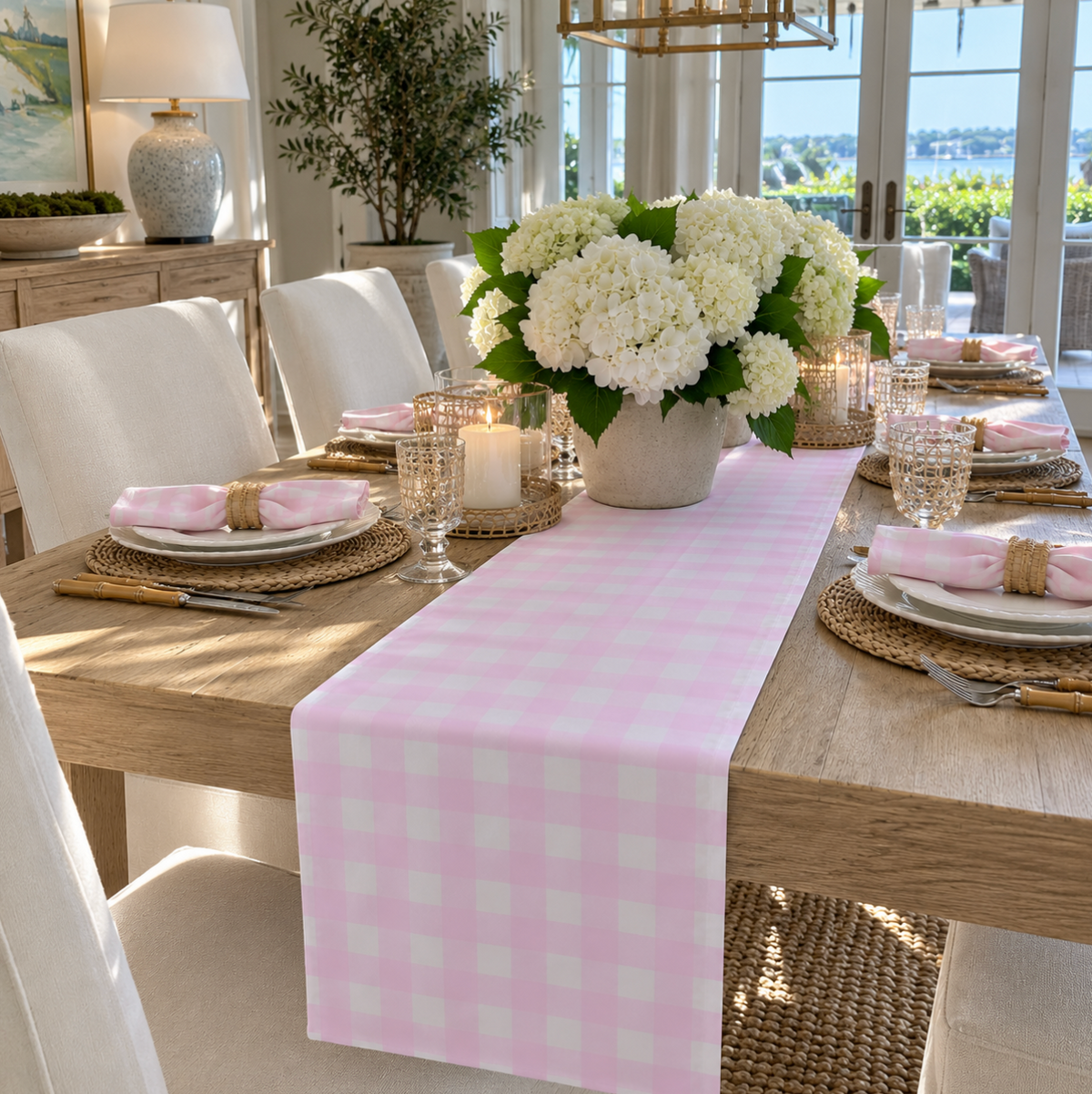 Coastal pink gingham table runner styled for casual dining and entertaining.
