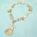 Rhinestone embellished starfish and pearl seashell pendant shell beaded statement necklace in coastal beach glam style