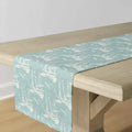 Light blue coastal sailboat table runner on a beach house dining table