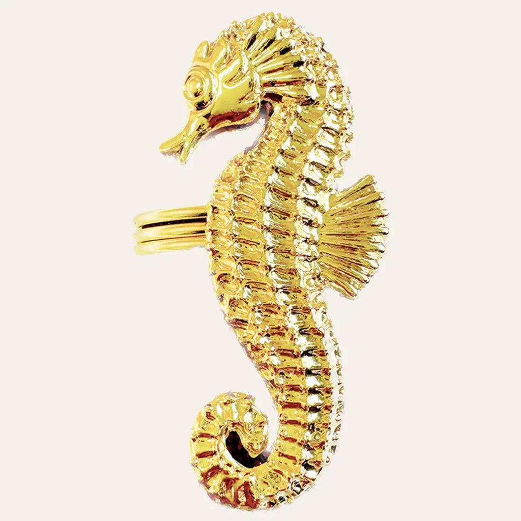 Gold seahorse napkin rings with curved seahorse design for coastal table decor