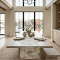 Coastal seashell table runner on a beach house dining table.