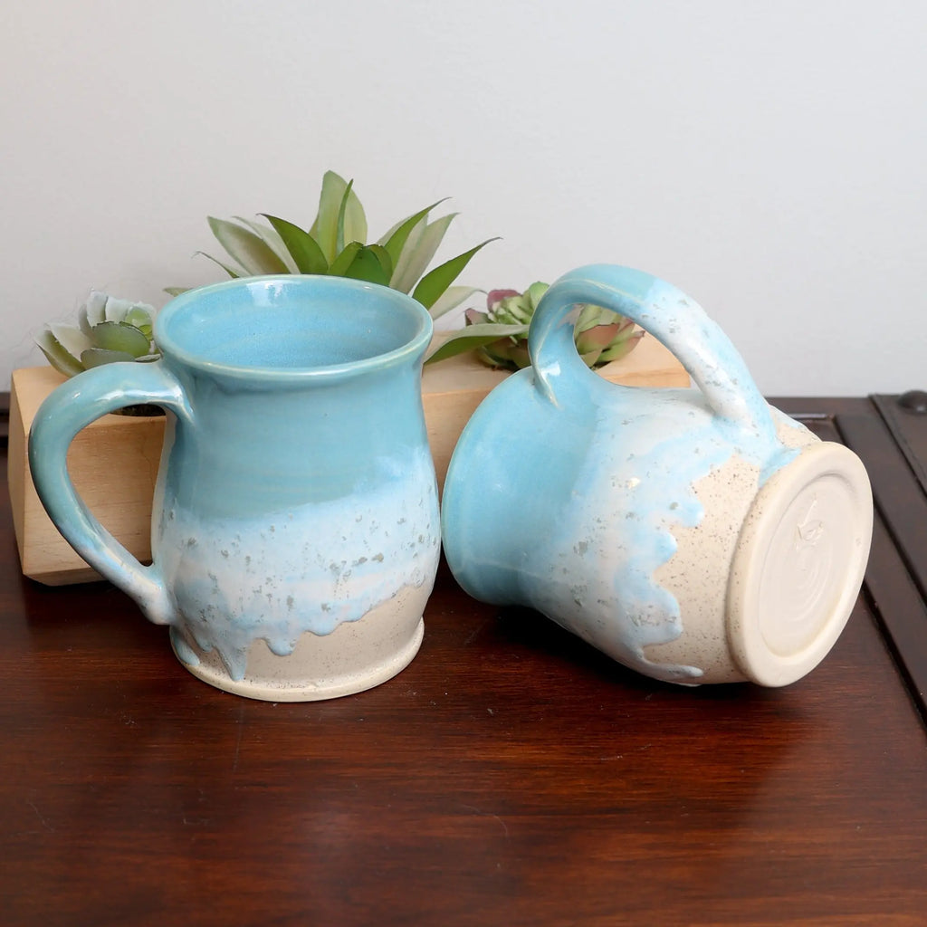 Artisan handmade ocean coffee mug with swirling blue glaze